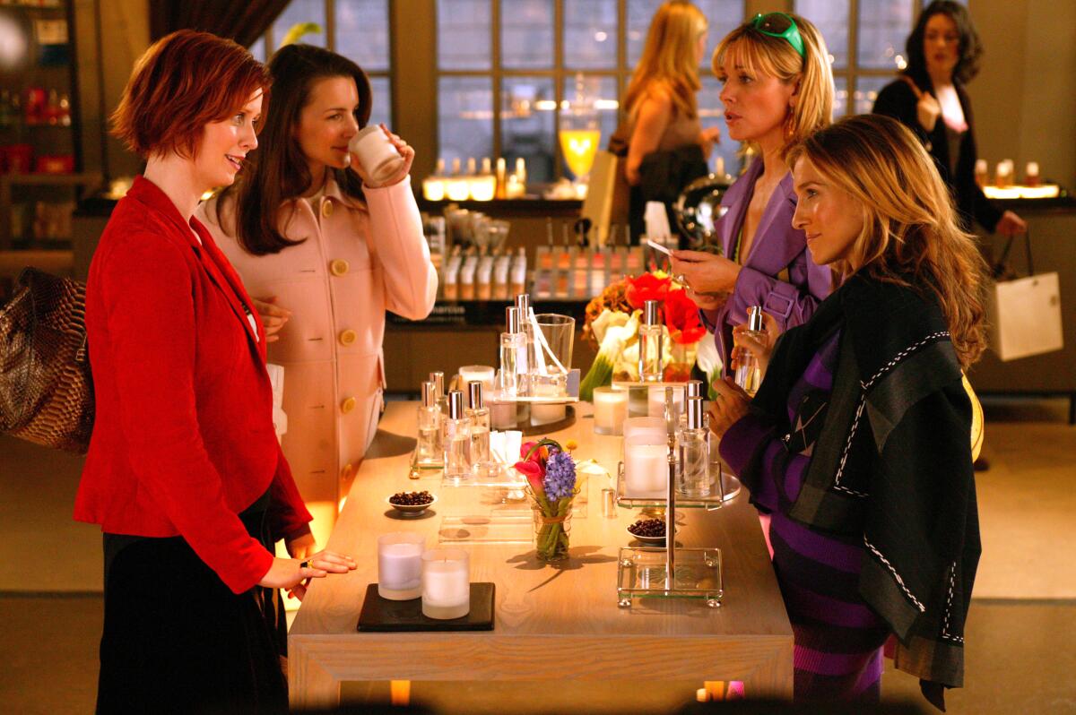 Sarah Jessica Parker, Kim Cattrall, Kristin Davis and Cynthia Nixon smell candles and other fragrances in "Sex and the City."