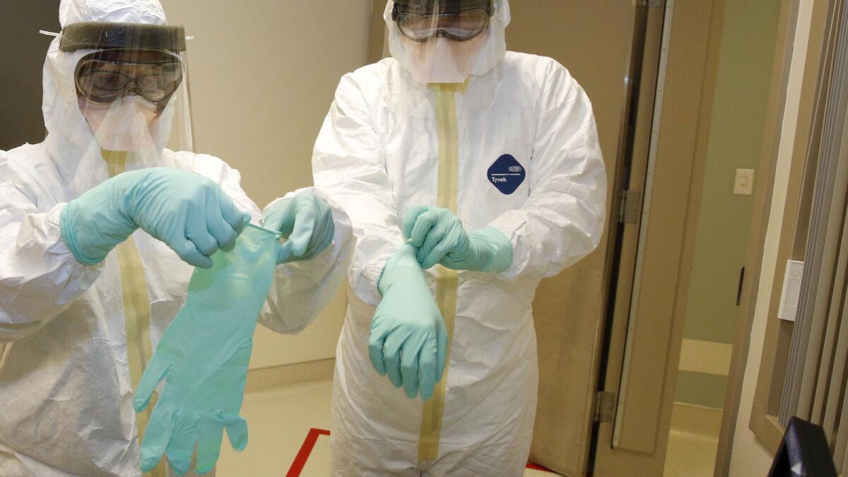 Protective gloves, gowns, masks and booties are discarded after use, contributing to the large amount of medical waste produced by treating Ebola.