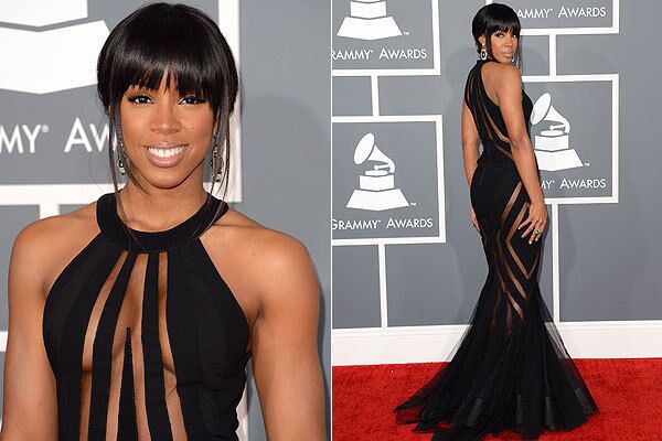 And Kelly Rowland is a vision in a black Georges Chakra gown with geometric mesh panels down the front and sides. A fashion daredevil, god love her.
