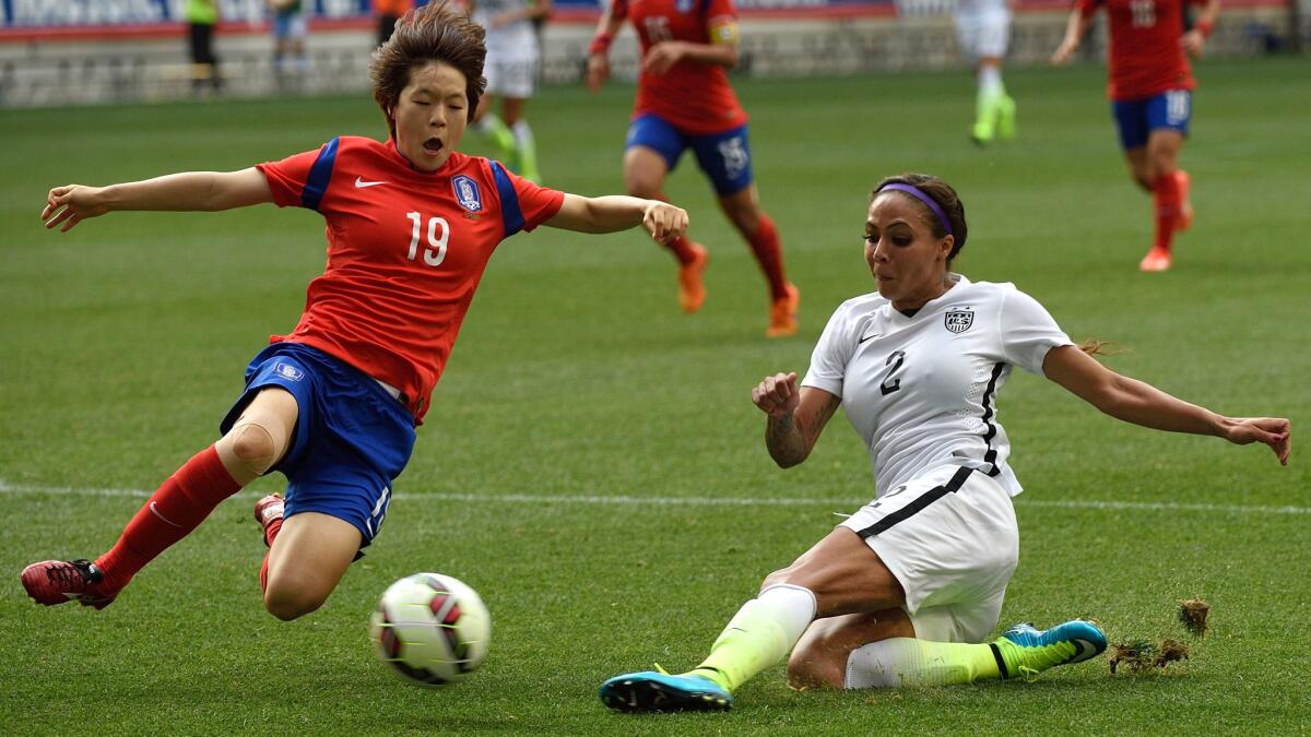 South Korea defender Kim Doyeon stops a shot by U.S. forward Sydney Leroux during their exhibition game on Saturday at Red Bulls Arena.