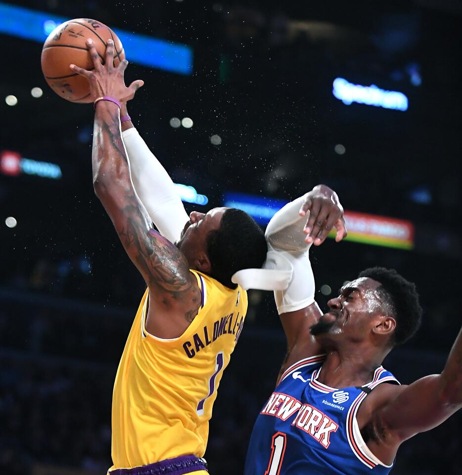 Kentavious Caldwell-Pope loses his headband after getting hit in the head by Knicks forward Bobby Portis during the second quarter of a game Jan. 7 at Staples Center.