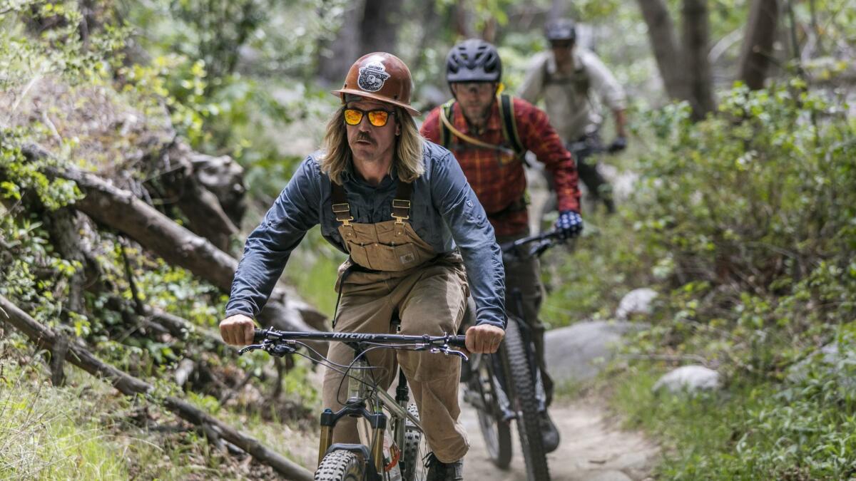 Matt Baffert, 37, trail boss for the Mt. Wilson Bicycling Assn., rides out with other volunteers.