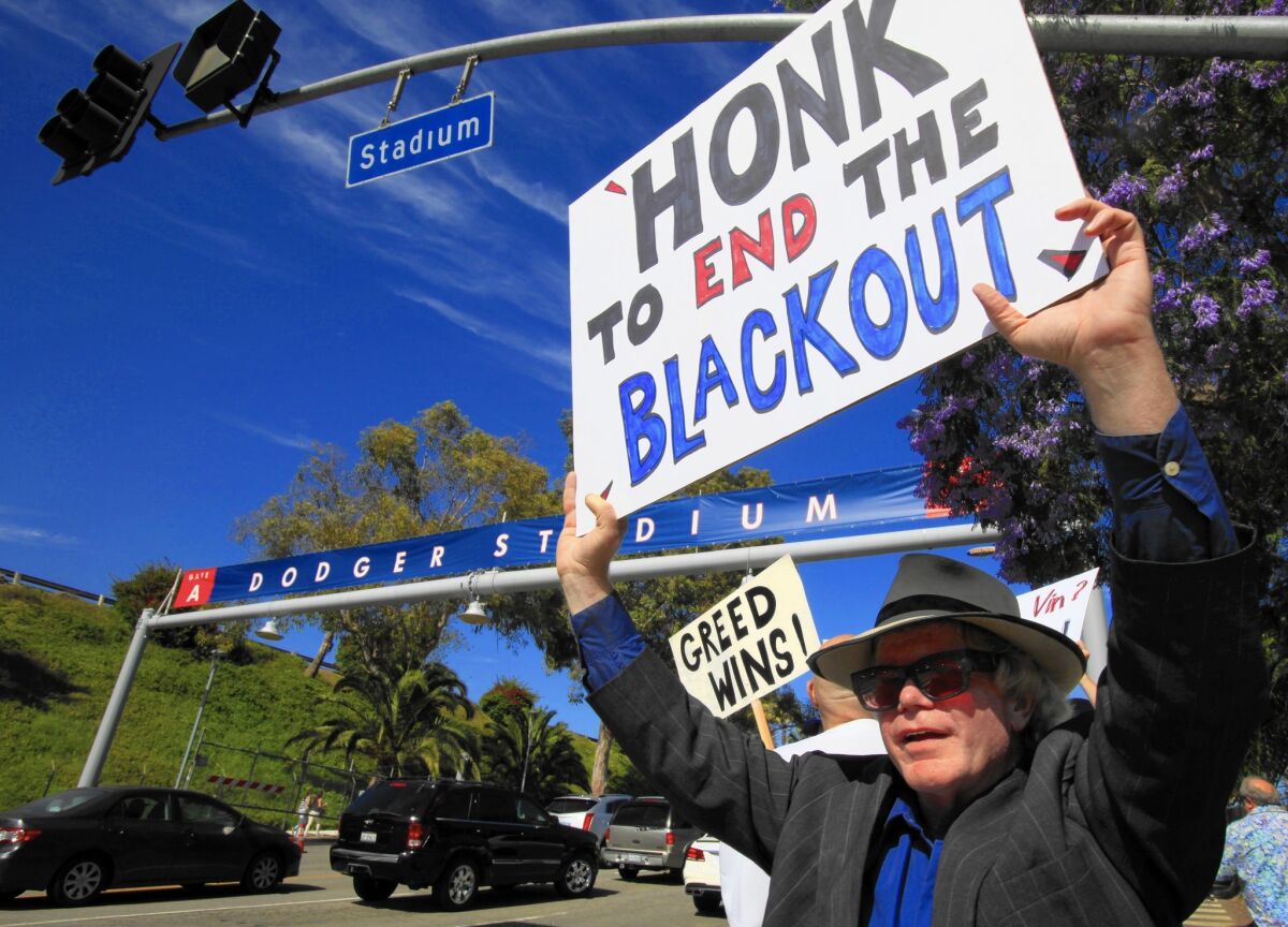 Bill Peterson of Los Angeles and about 25 others protest the TV blackout outside Dodger Stadium in 2015.