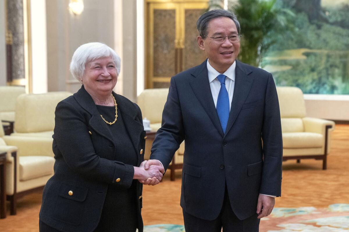 U.S. Treasury Secretary Janet Yellen shaking hands with Chinese Premier Li Qiang
