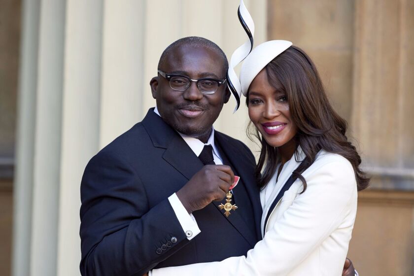Mandatory Credit: Photo by REX/Shutterstock (6897943w) Edward Enninful after receiving his Officer of the Order of the British Empire (OBE) and Naomi Campbell Investitures at Buckingham Palace, London, UK - 27 Oct 2016