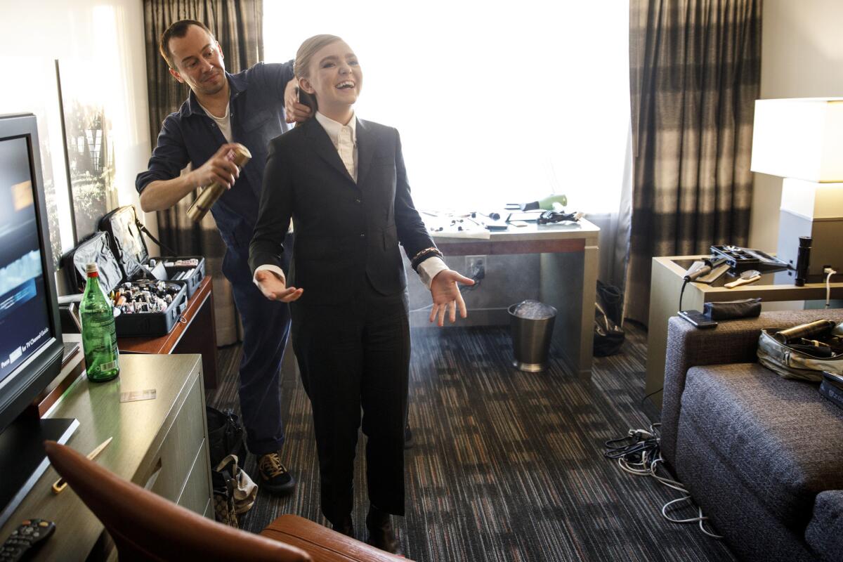 Actress Elsie Fisher dances in her hotel room while getting ready for the Governors Awards.
