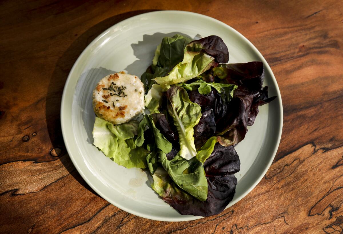 Baked goat cheese with a garden salad.