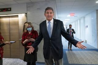 In this Dec. 13, 2021, photo, Sen. Joe Manchin, D-W.Va., leaves his office after speaking with President Joe Biden about his long-stalled domestic agenda, at the Capitol in Washington. Manchin’s reluctance to endorse the Biden administration’s expanded child tax credit program is rippling through his home state of West Virginia. Manchin, a moderate Democrat, is one of the last holdouts delaying passage of President Joe Biden’s massive social and environmental package. (AP Photo/J. Scott Applewhite)