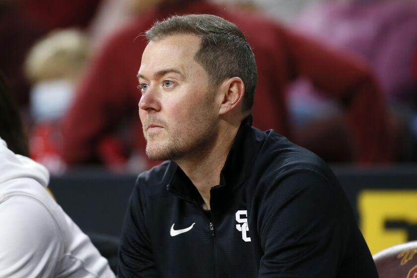 Southern California head football coach Lincoln Riley is watches during the first half of an NCAA college basketball game against Long Beach State in Los Angeles, Sunday, Dec. 12, 2021. (AP Photo/Alex Gallardo)
