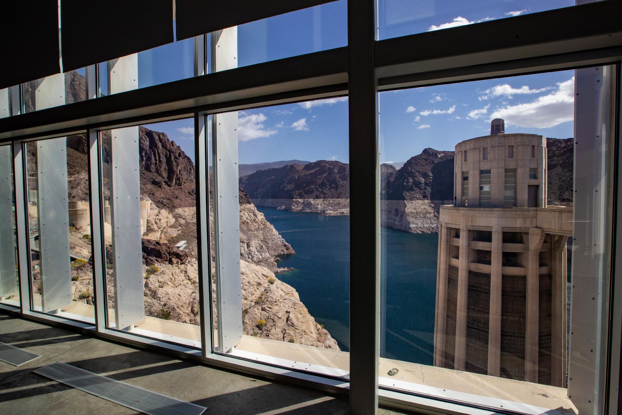  Lake Mead framed through a glass of an observation deck atop the Hoover Dam.
