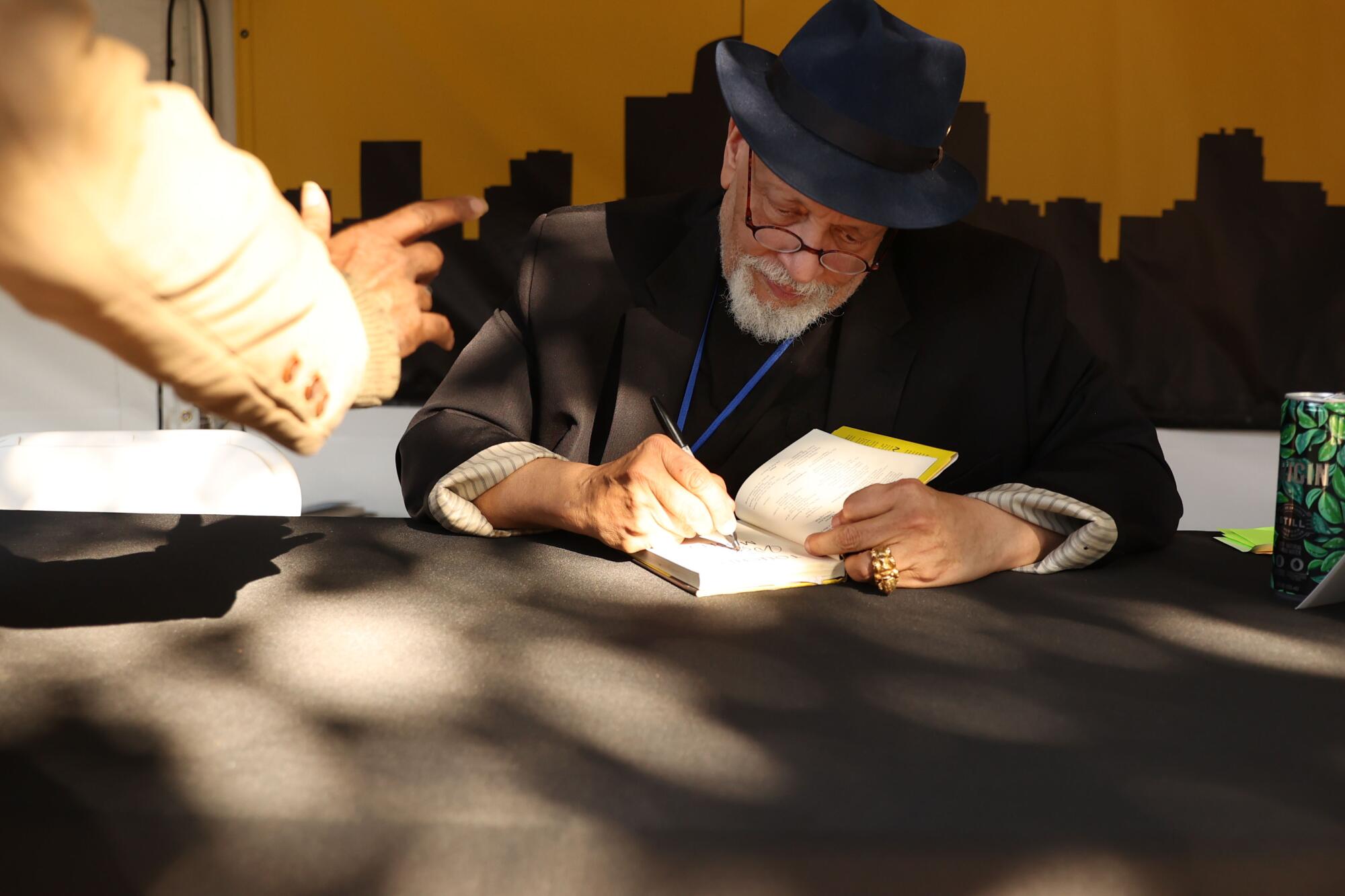 Walter Mosley signs copies of his book.