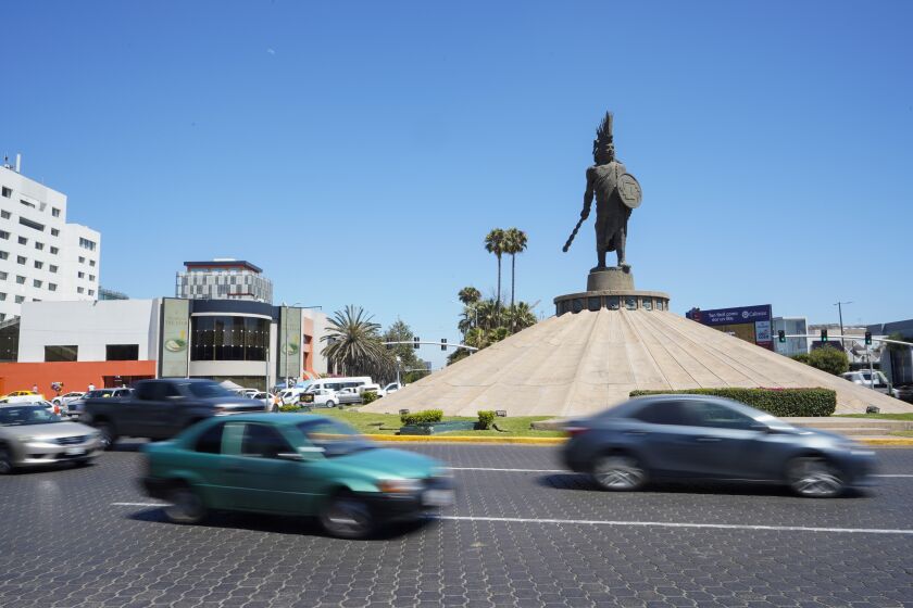 Tijuana, Baja California - July 06: City life in Tijuana. Traffic flowing around the monument of Aztec Emperor Cuauhtemoc in Zona Rio on Wednesday, July 6, 2022 in Tijuana, Baja California. (Alejandro Tamayo / The San Diego Union-Tribune)