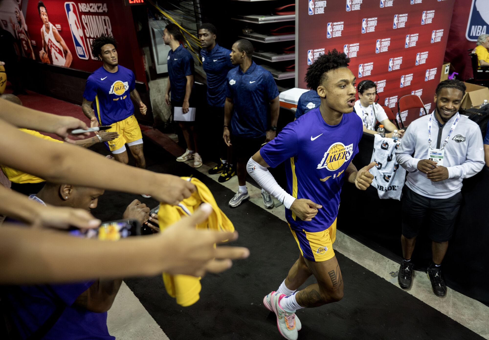 Maxwell Lewis jogs to the court during an NBA Summer League game against the Boston Celtics.