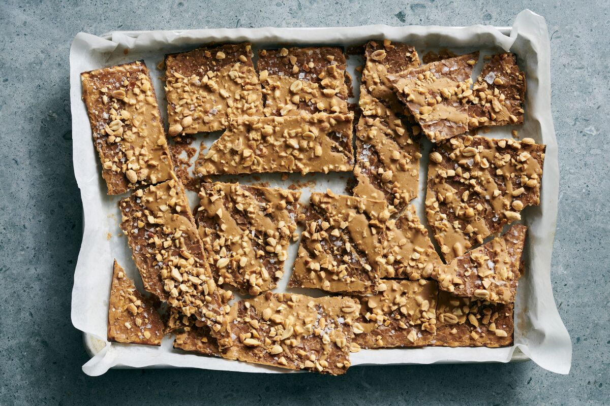 Salted peanut and caramel matzo brittle on a pan.