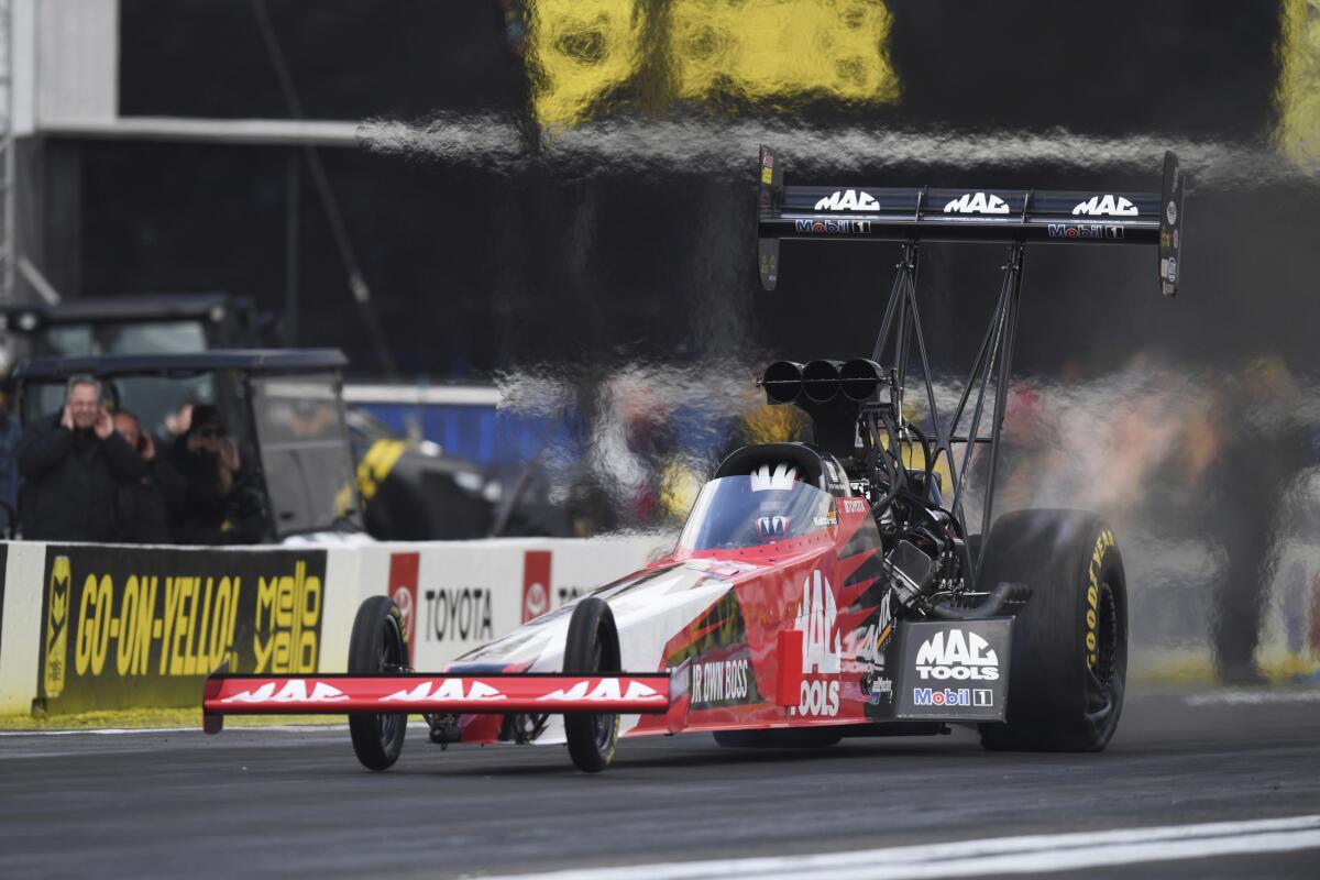 Doug Kalitta competes in the final round at the NHRA Winternationals at Auto Club Raceway in Pomona on Sunday.