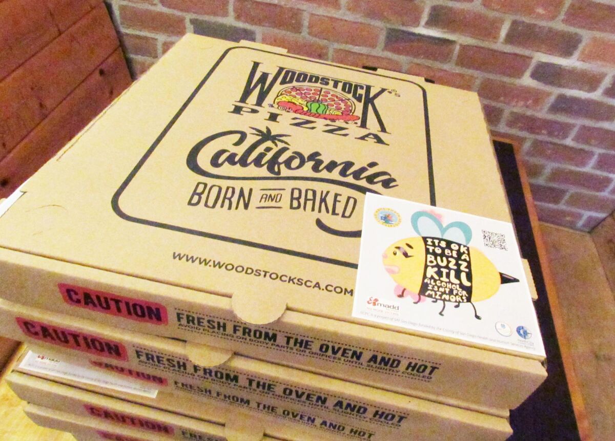The pizza box sticker created by Mission Bay High School Youth Advocates members.