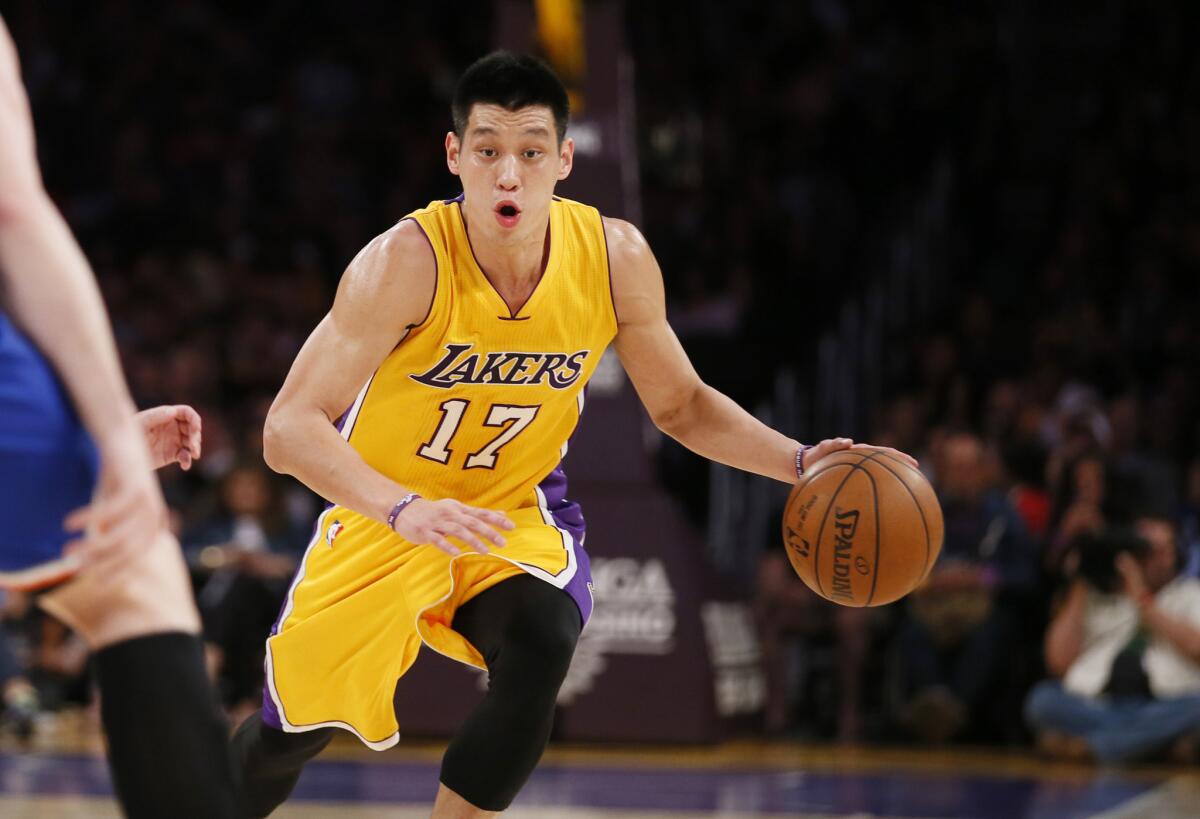 Lakers point guard Jeremy Lin dribbles the ball up the court against the Knicks during the second half.