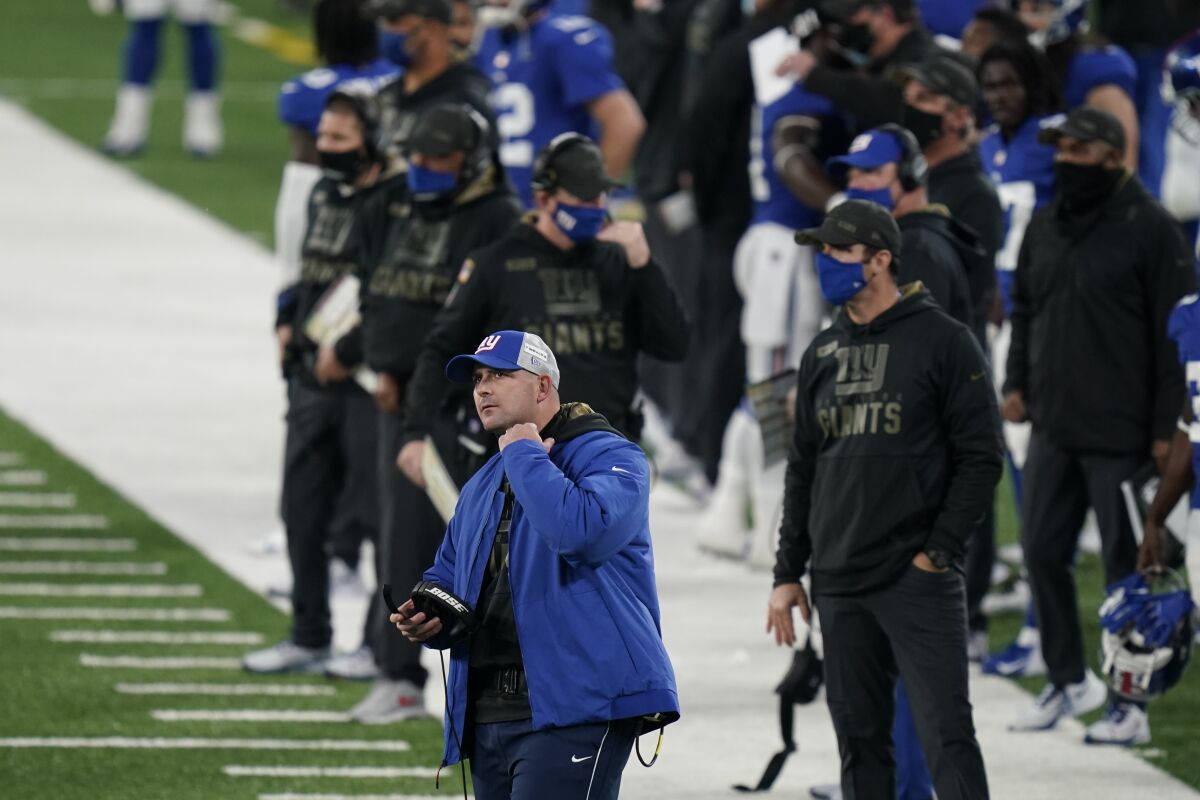 New York Giants head coach Joe Judge, front left, reacts during the second half of an NFL football game against the Philadelphia Eagles, Sunday, Nov. 15, 2020, in East Rutherford, N.J. (AP Photo/Seth Wenig)