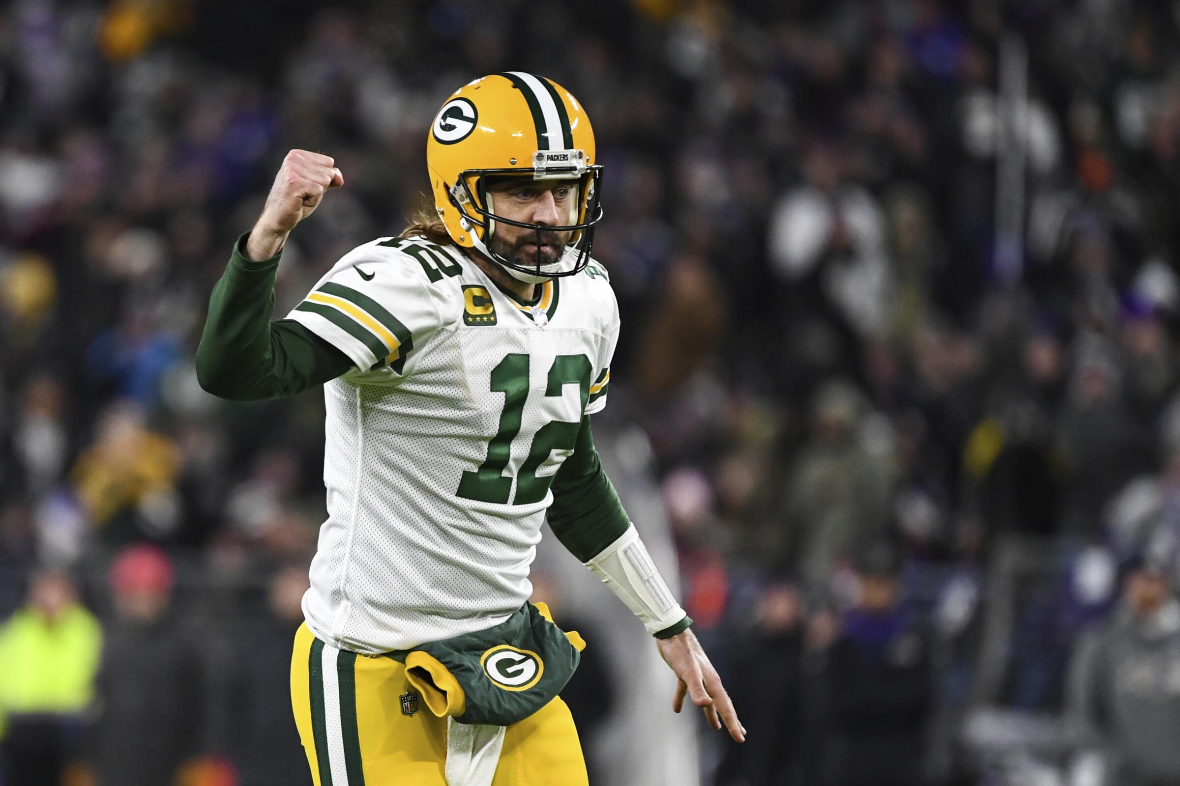 Green Bay Packers quarterback Aaron Rodgers reacts to throwing a touchdown.