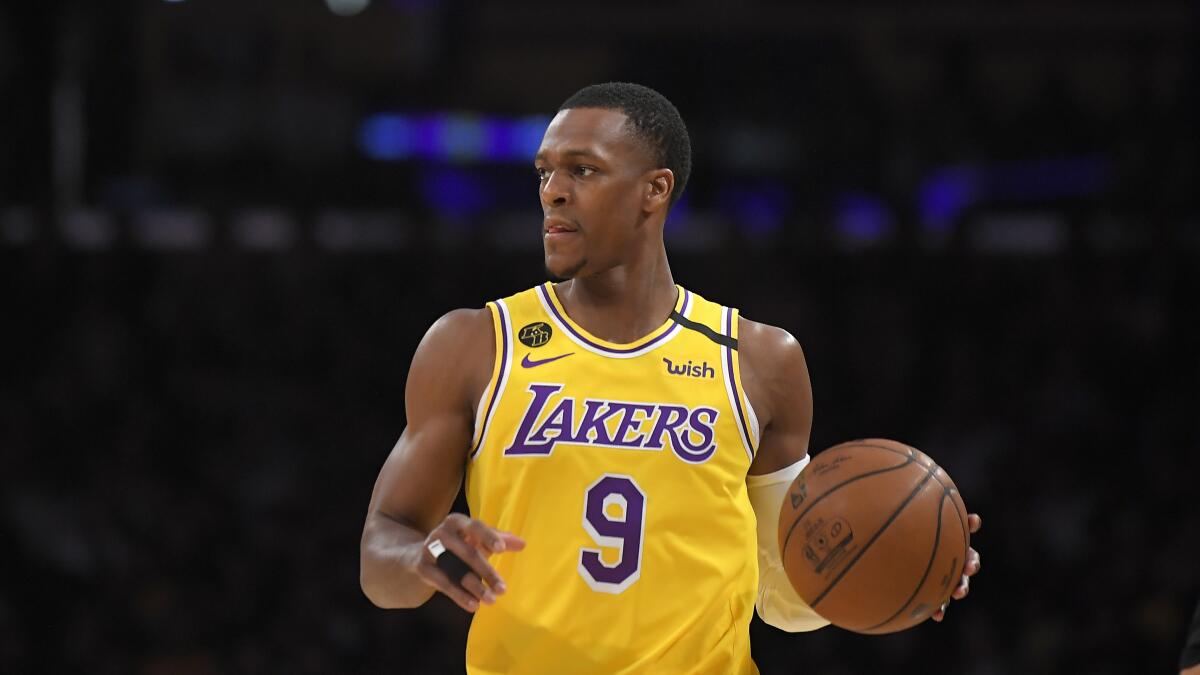 Los Angeles Lakers guard Rajon Rondo dribbles.