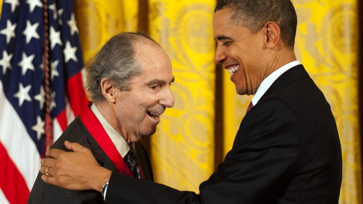 President Barack Obama presents the National Humanities Medal to Philip Roth in 2011.