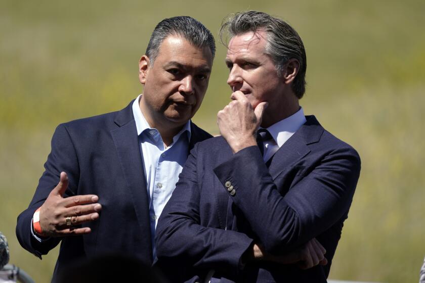 FILE - California Gov. Gavin Newsom, right, talks to Sen. Alex Padilla, D-Calif., during a ground breaking ceremony for the Wallis Annenberg Wildlife Crossing, Friday, April 22, 2022, in Agoura Hills, Calif. Padilla, who was appointed by Newsom, will face Republican constitutional lawyer Mark Meuser to fill the last two months of Kamala Harris' U.S. Senate term and the other for a new six-year term. (AP Photo/Marcio Jose Sanchez, File)