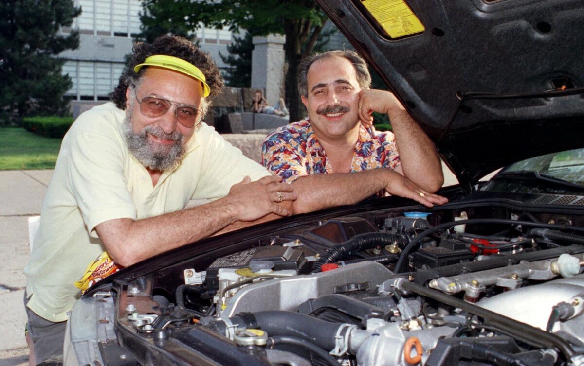 "Car Talk" hosts Tom, left, and Ray Magliozzi, known as "Click and Clack, the Tappet brothers," in Boston in 1991. Tom died Monday at the age of 77.