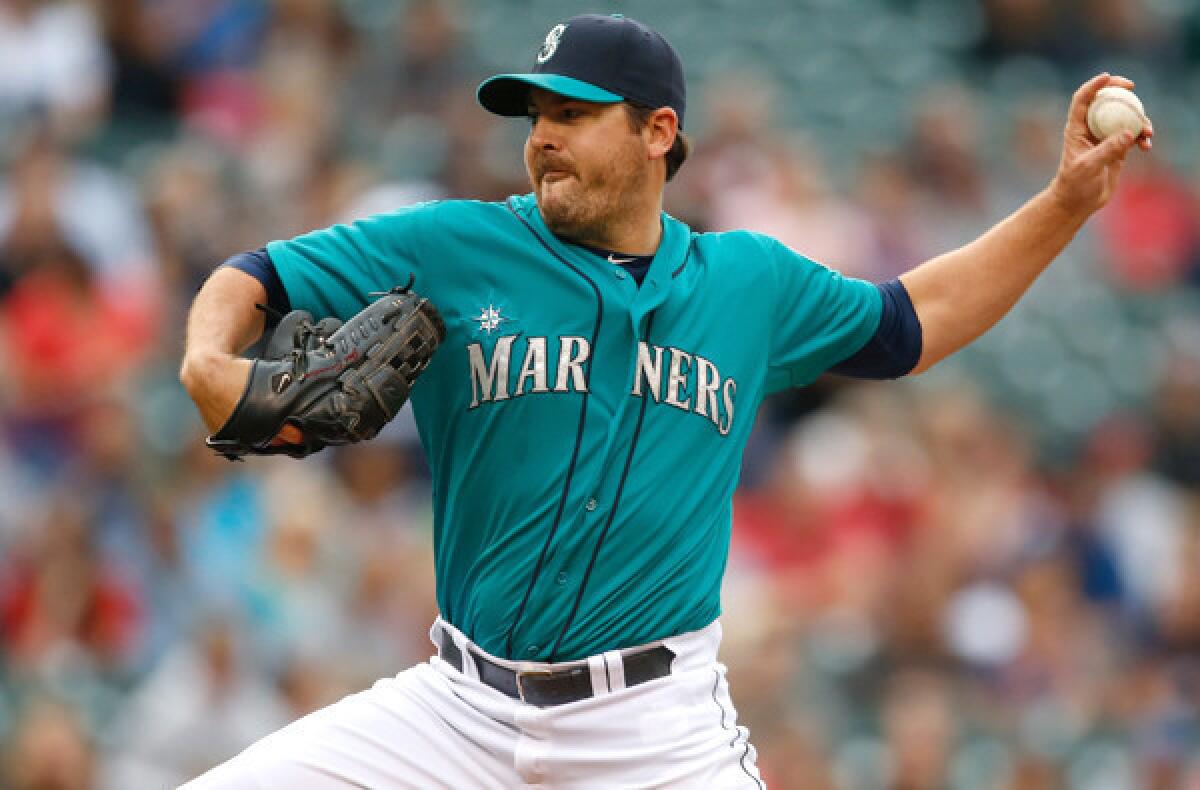 Mariners starter Joe Saunders blanked the Angels on five hits in seven innings, striking out five and walking two, to improve to 8-8 on Friday night.