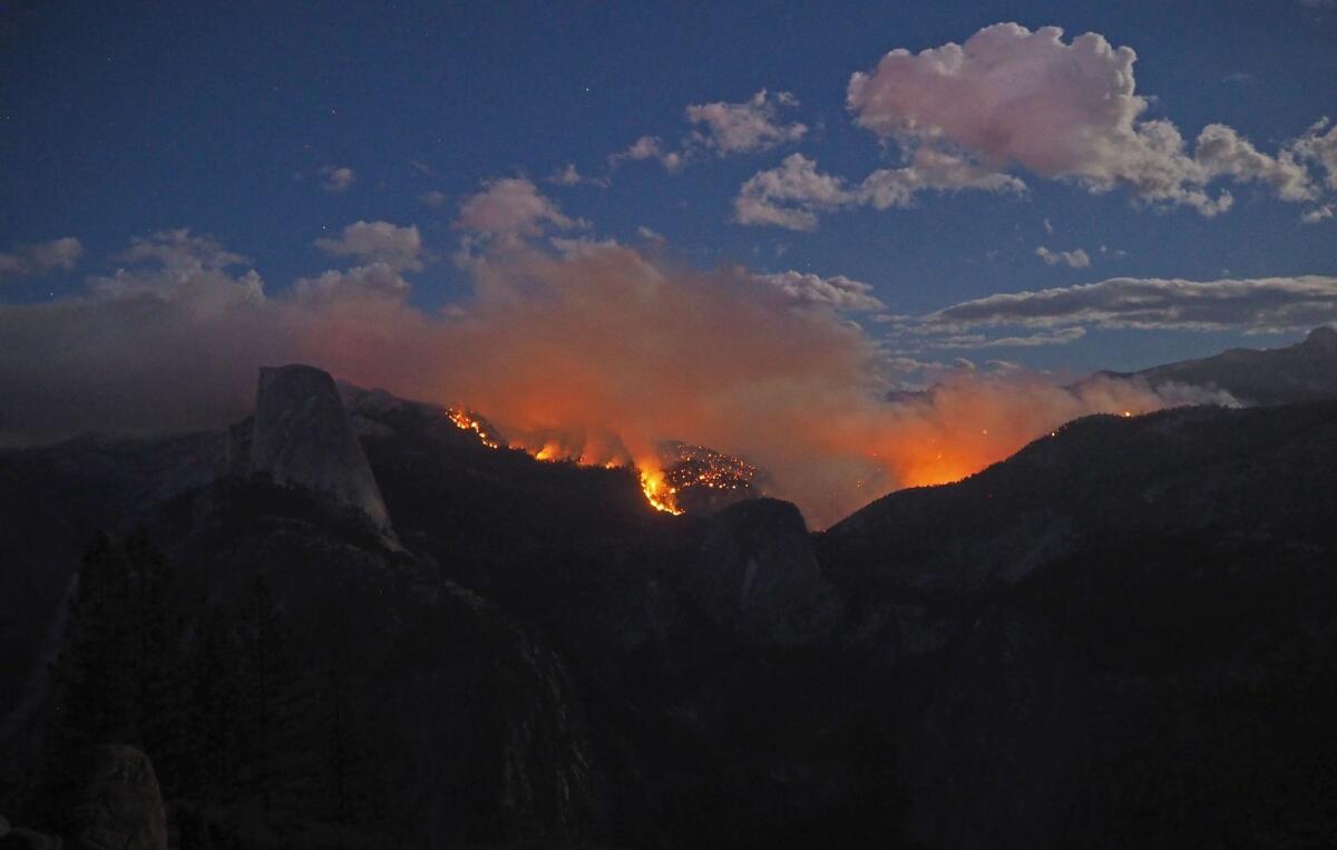 The Meadow fire burning in a wilderness area of Yosemite National Park. The photo taken Tuesday shows the glow of flames.