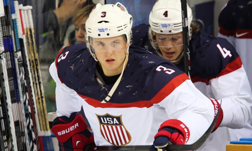 U.S. defenseman Cam Fowler steps on the ice before a Olympic quarterfinal game against the Czech Republic.