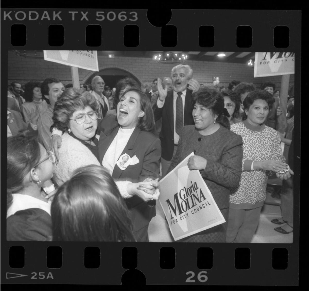 Gloria Molina is surrounded by her mother and supporters as she celebrates her City Council victory in 1987.