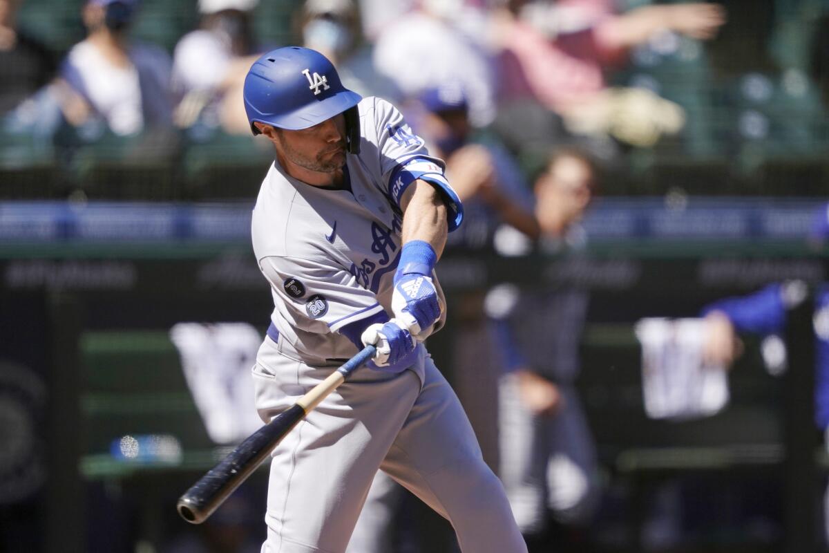 Dodgers' AJ Pollock doubles against the Seattle Mariners.