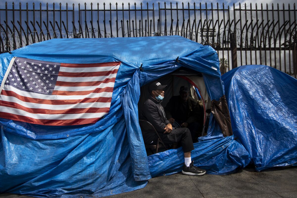 David Barker visits a friend living in a tent on skid row in Los Angeles.