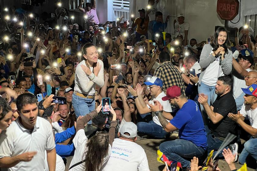 Venezuelan opposition leader Maria Corina Machado addresses supporters gathered in Sabana de Mendoza, Venezuela, Wednesday, May 8, 2024. Edmundo González Urrutia became the opposition Unitary Platform's candidate for president after Machado, who won the opposition's presidential primary in 2023, and her handpicked alternative were banned from registering for the July 28 election. (AP Photo/Regina Garcia Cano)