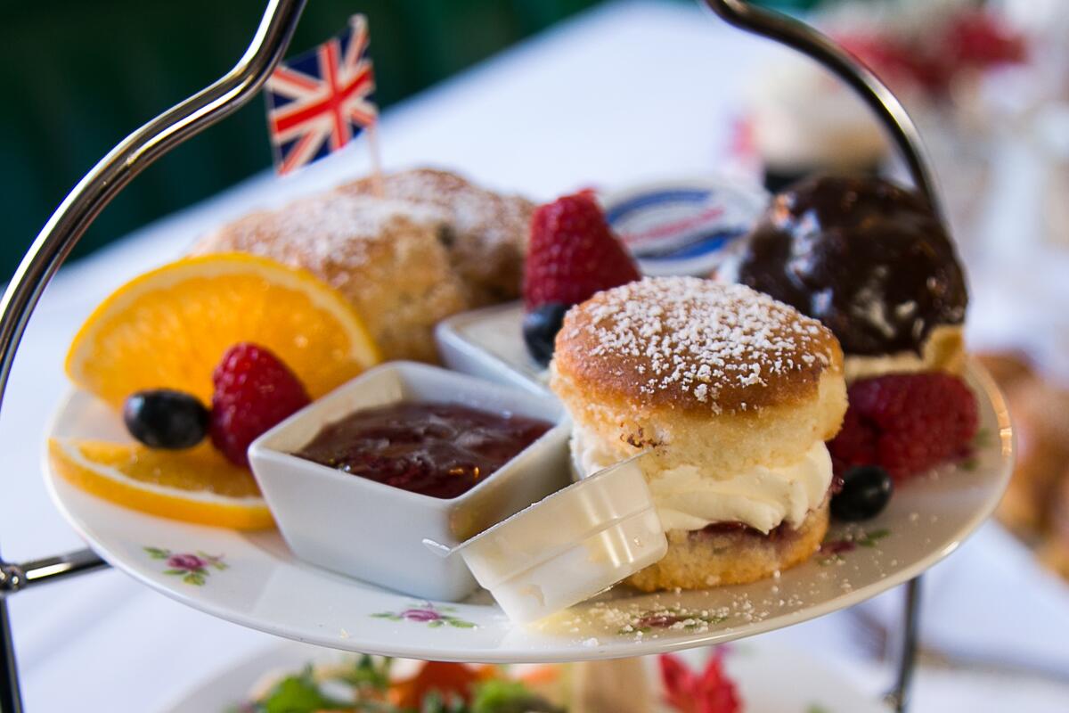 a selection of pastries and jam on a tray