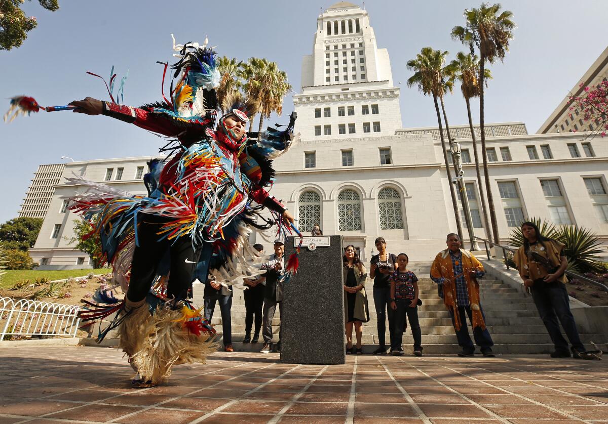 Kenneth Thomas Shirley, a Navajo Nation champion dancer and the CEO of Indigenous Enterprise, performs at Los Angeles City Hall in advance of the city's Indigenous People's Day celebration.