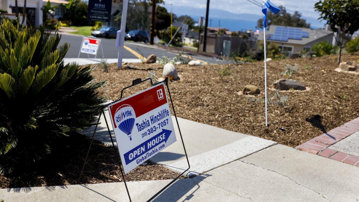 A sign points toward an open house in the Hollywood Riviera neighborhood of Torrance.