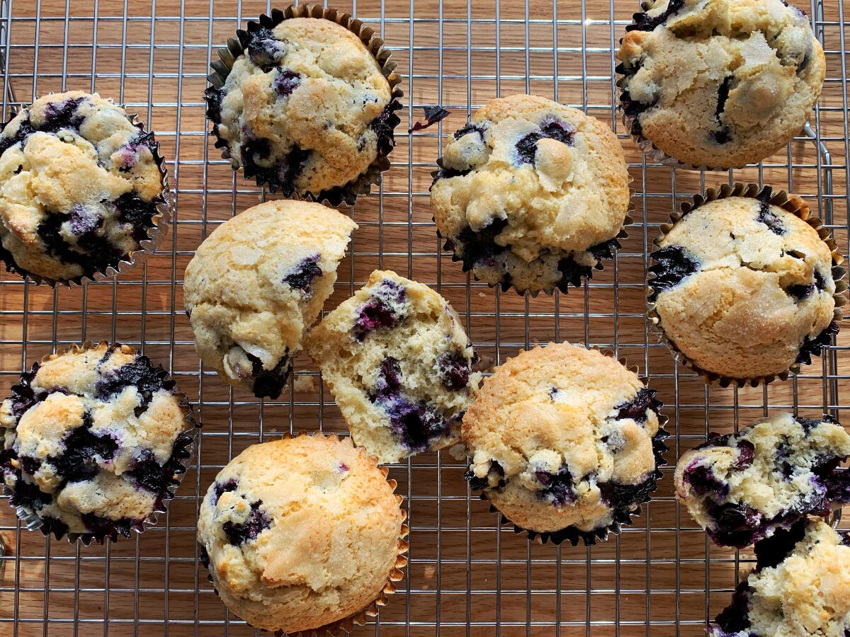 Blueberry muffins on a cooling rack.