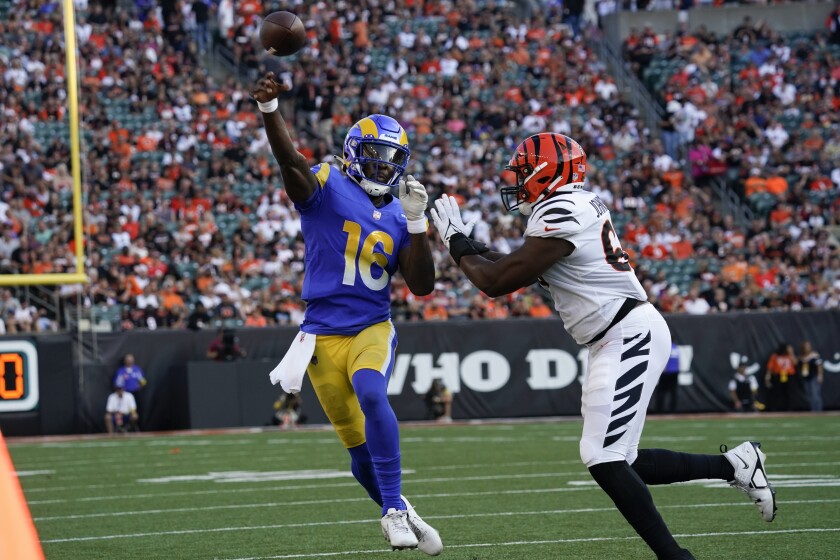 Rams quarterback Bryce Perkins throws under pressure from Bengals defensive end Raymond Johnson III on Aug. 27, 2022.