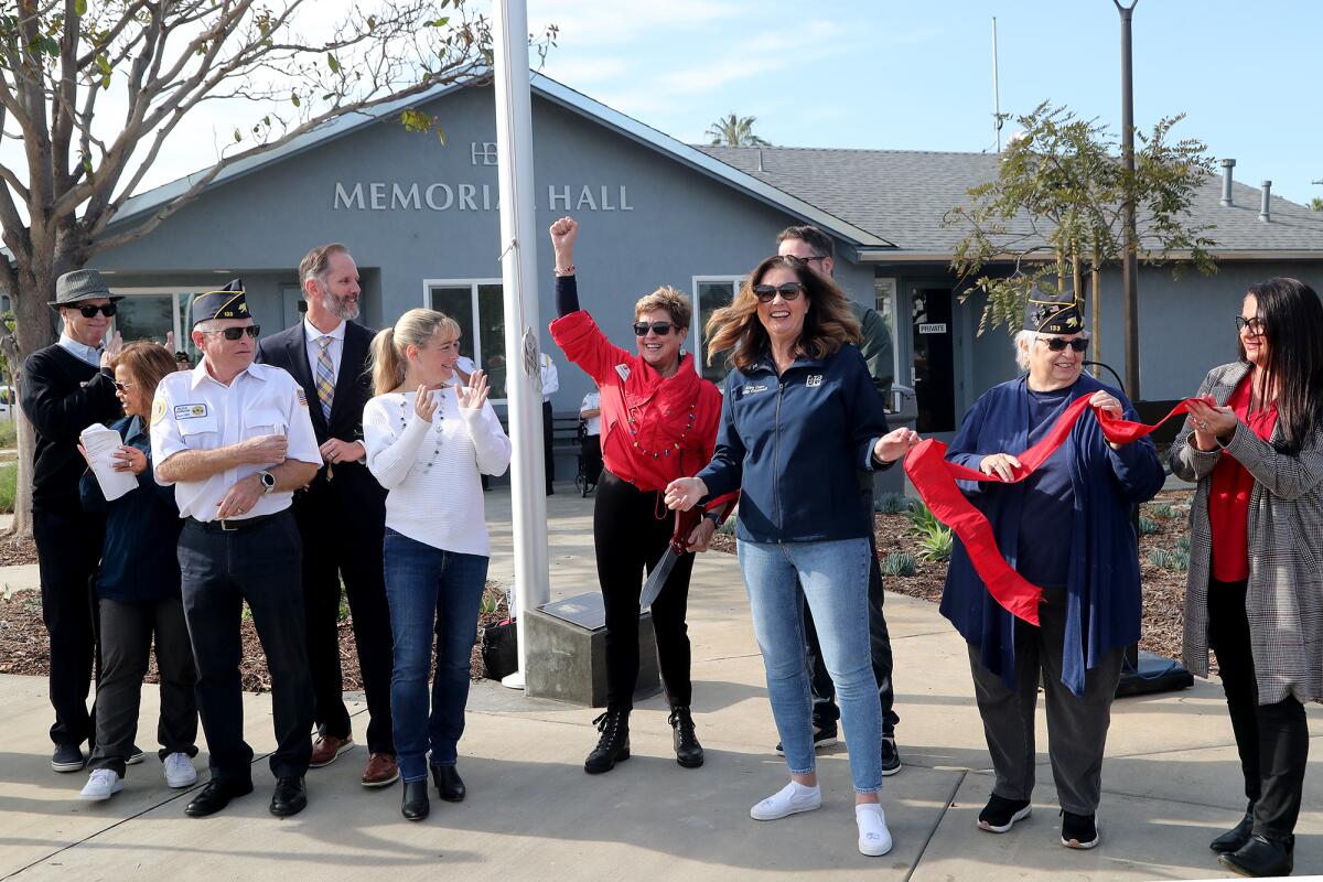 Mayor Barbara Delgleize, center, celebrates during a dedication ceremony for the new 17th Street Park.