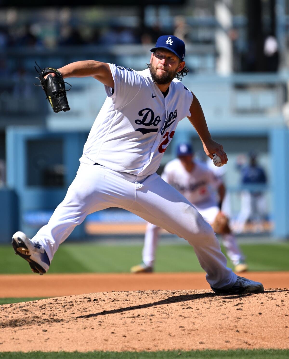 Dodgers pitcher Clayton Kershaw throws a pitch against the Colorado Rockies.