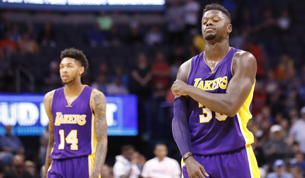 Lakers forwards Julius Randle, right, scores 20 points and Brandon Ingram contributes nine in the Lakers' 113-96 loss to the Oklahoma City Thunder.