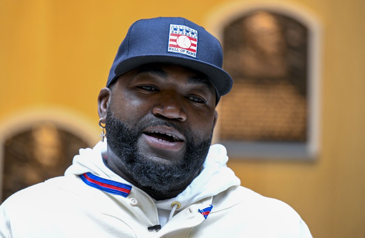 FILE - David Ortiz speaks to reporters during a news conference after his orientation tour of the Baseball Hall of Fame and Museum, Monday, May. 2, 2022, in Cooperstown, N.Y. The former Boston Red Sox player will be inducted into the Baseball Hall of Fame on Sunday, July 24. (AP Photo/Hans Pennink, File)