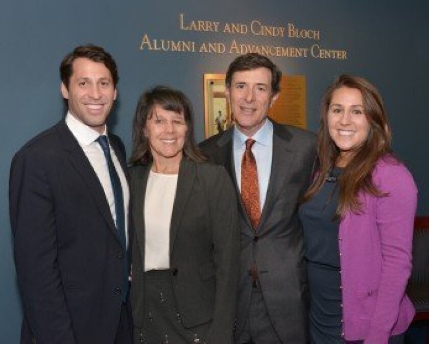 Larry ‘75 and Cindy Bloch (center) were joined by their children, Matt (left) and Reisa (right), to mark the dedication of the Larry and Cindy Bloch Alumni and Advancement Center at the University of Rochester.