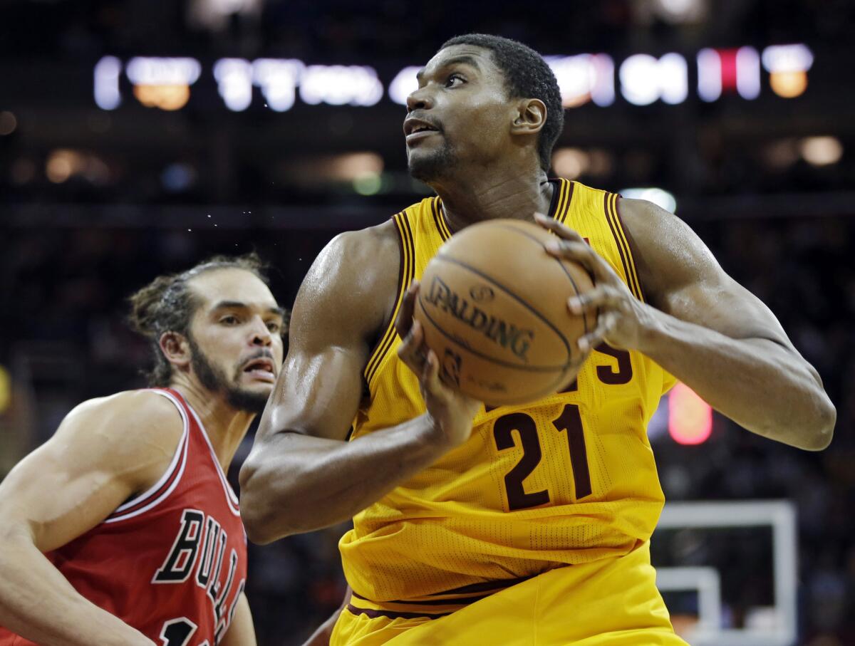 Cavaliers center Andrew Bynum (21) spins away from Bulls center Joakim Noah for a shot during a game last month in Cleveland. Bynum had 20 points and 10 rebounds in the Cavs' 97-93 win.