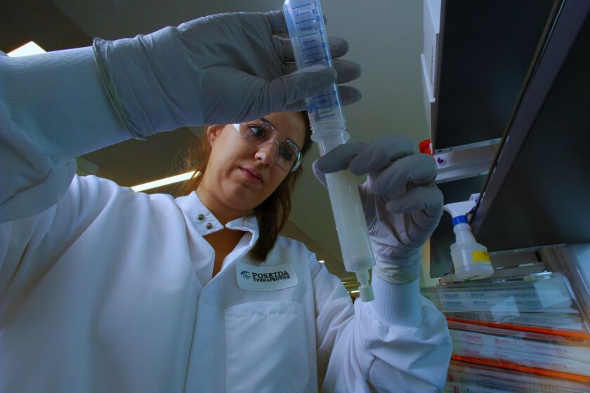 Research technician Rebecca Codde works on DNA extraction at Poseida Therapeutics. / photo by Nelvin C. Cepeda