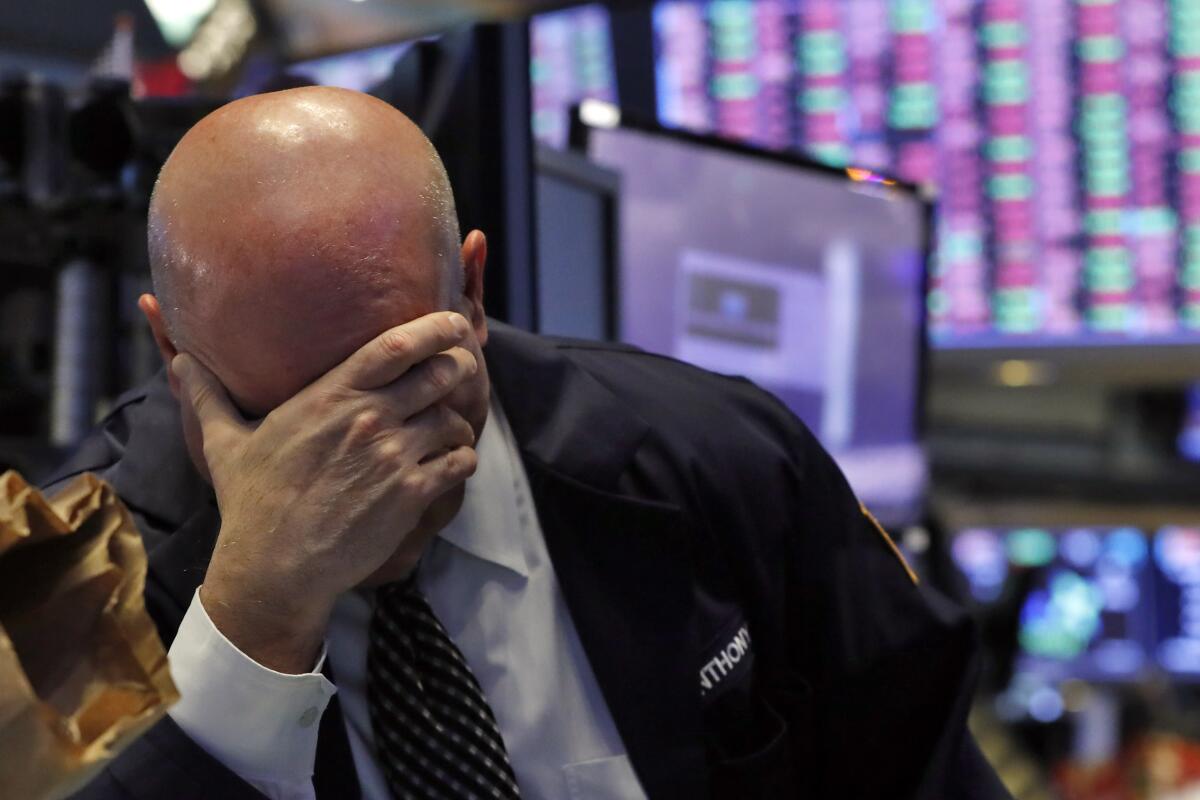 A trader on the floor of the New York Stock Exchange