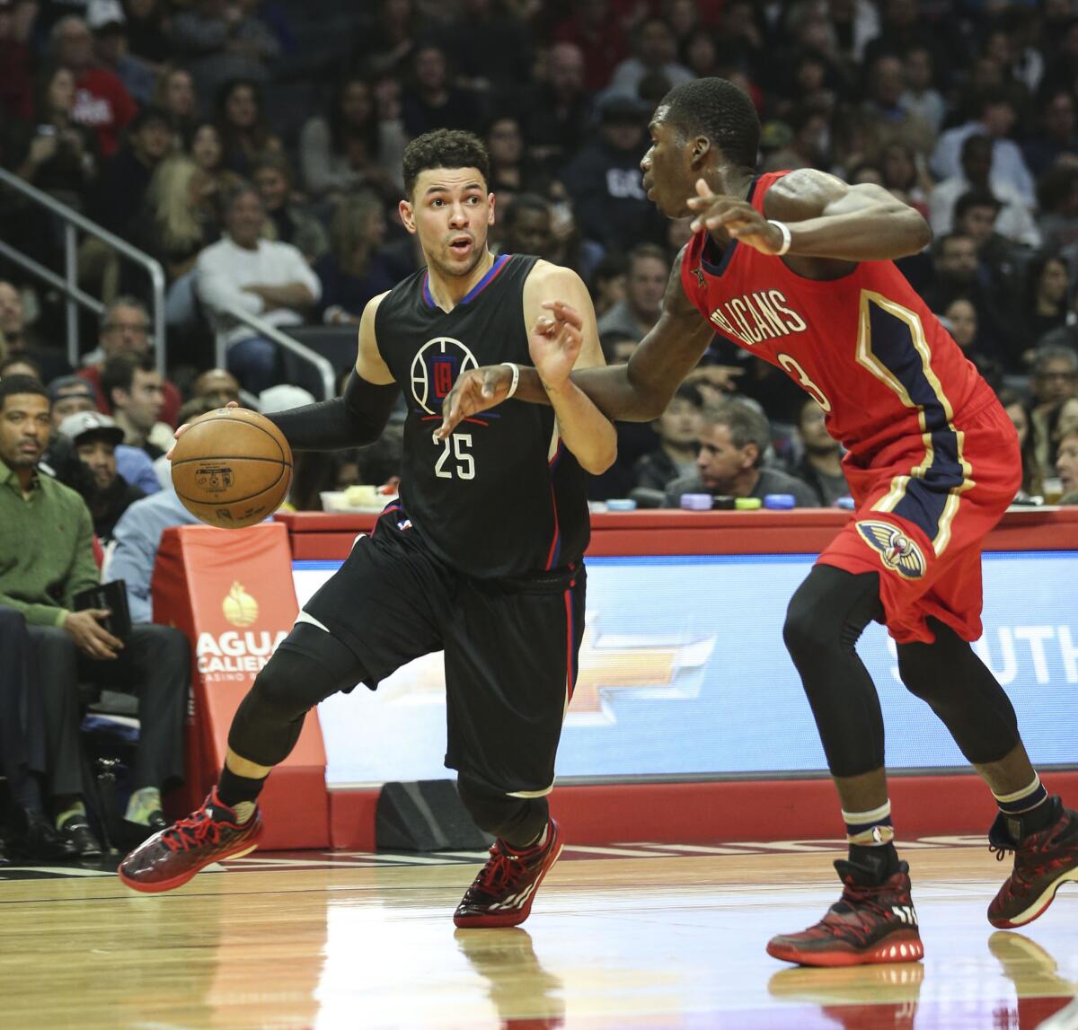 Clippers guard Austin Rivers drives against New Orleans forward Cheick Diallo on Saturday in a game in which he suffered a concussion.
