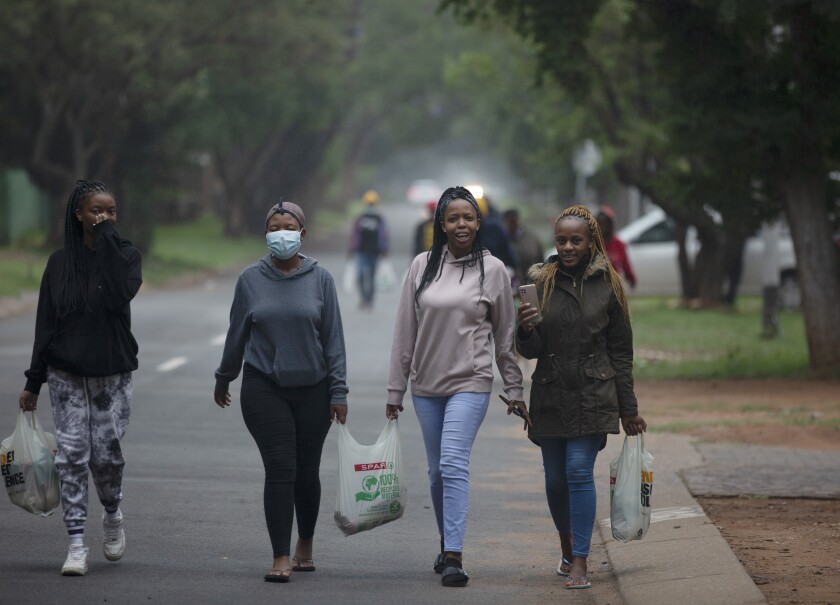 Students from the Tshwane University of Technology walk to their residence in Pretoria, South Africa. 