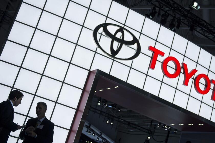 (FILES) This January 22, 2014 file photo shows people near the Toyota display during the Washington Auto Show in Washington, DC. Toyota on October 20, 2014 expanded its recall of cars facing the risk of an air bag rupturing, recalling about 247,000 cars in the United States to replace Takata Corporation-supplied parts.Toyota Motor Sales USA said it was recalling Toyota Corolla, Matrix, Sequoia, Tundra and Lexus vehicles produced from 2001 to 2004 to replace the air bag inflator for the front passenger seat. AFP PHOTO/Brendan SMIALOWSKIBRENDAN SMIALOWSKI/AFP/Getty Images ** OUTS - ELSENT, FPG - OUTS * NM, PH, VA if sourced by CT, LA or MoD **